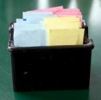 container filled with packets of artificial sweeteners container filled with packets of artificial sweeteners